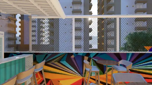 Varanda com bar, banquetas e um mural geométrico multicolorido